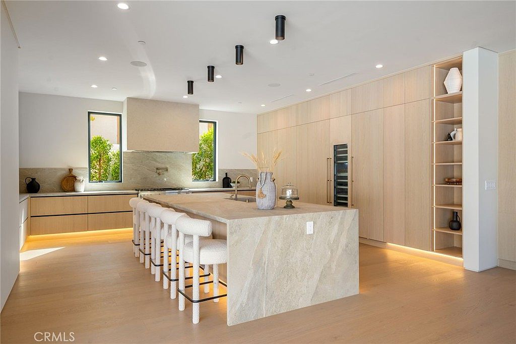 Family room with statement fireplace and California living design