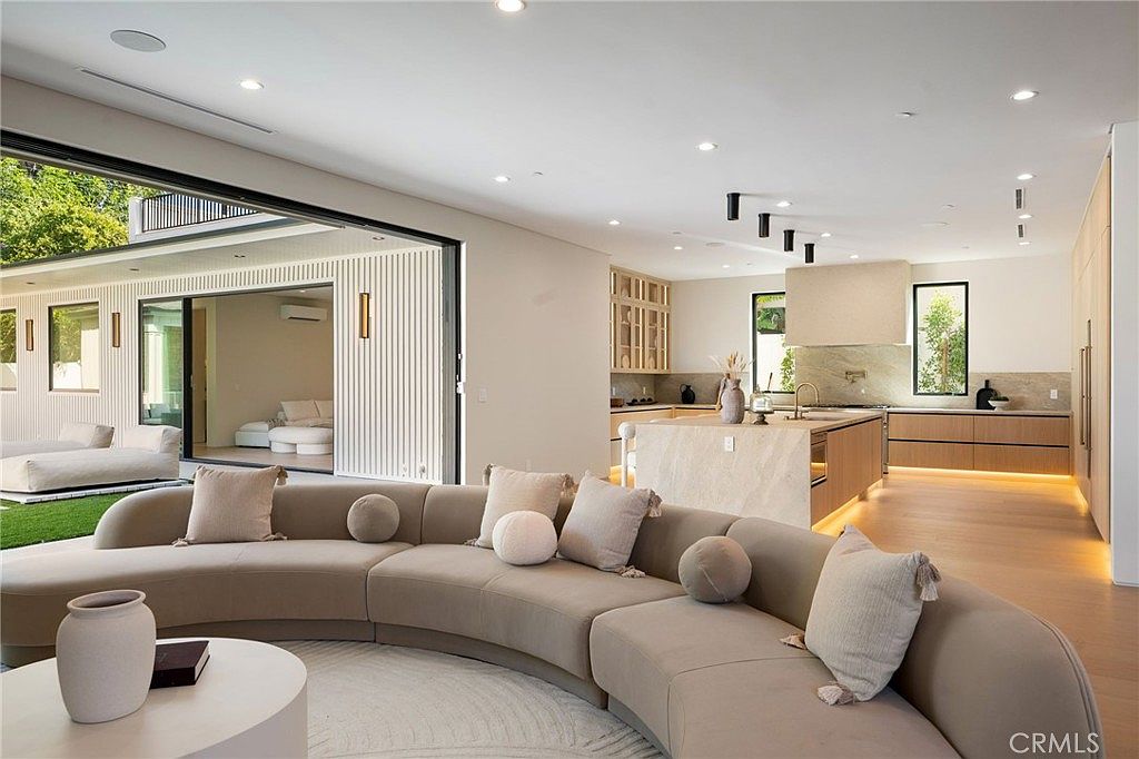 Sparkling pool and spa with outdoor living